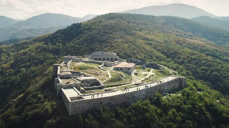 Aerial view of Prizren Fortress on its wooded hill